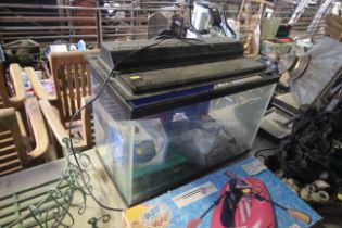 An aquarium measuring approx. 23.5" x 12" x 15" with various filters, accessories etc