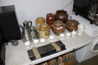 A cased carving set; various stone ware jars; stai