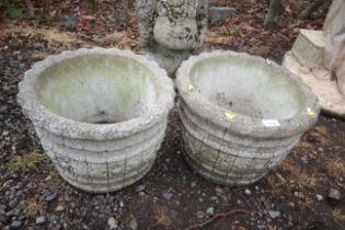 A pair of ornate concrete planters