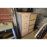 A wooden effect four drawer filing chest with key