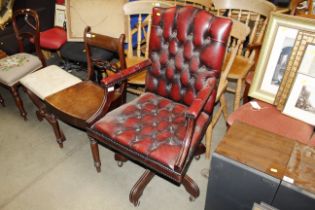 A button down upholstered swivel office chair