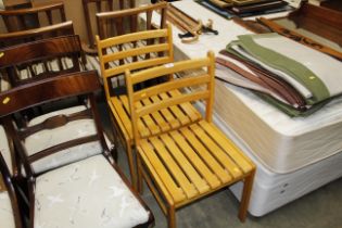 A pair of wooden bar back chairs