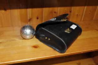 A bag containing four boules