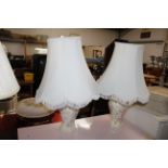 A pair of floral decorated table lamps and shades