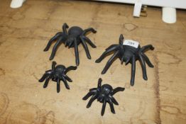 Four metal model spiders (136)