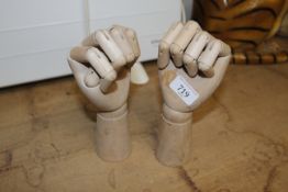 Two artists model wooden hands (237)