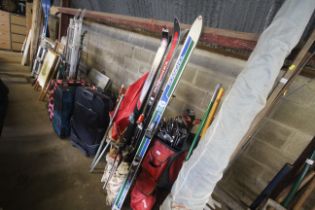 Two pairs of Rossignol skis and a pair of Dynastar