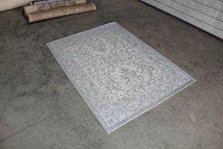 An approx. 5'6"' x 4" modern patterned rug