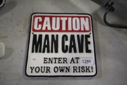 A painted cast iron sign 'Caution Man Cave Enter At Your Own Risk' (210)