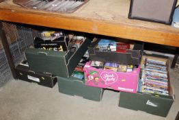 Six boxes containing cassette tapes, DVDs includin