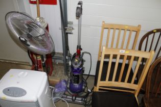 A Dyson DC24 upright vacuum cleaner