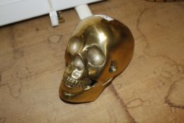 A metal model of a skull (100)