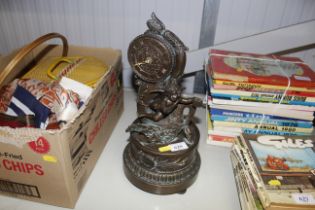 A bronzed figural decorated clock