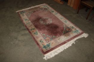 An approx. 7' x 4' "' Chinese style patterned rug