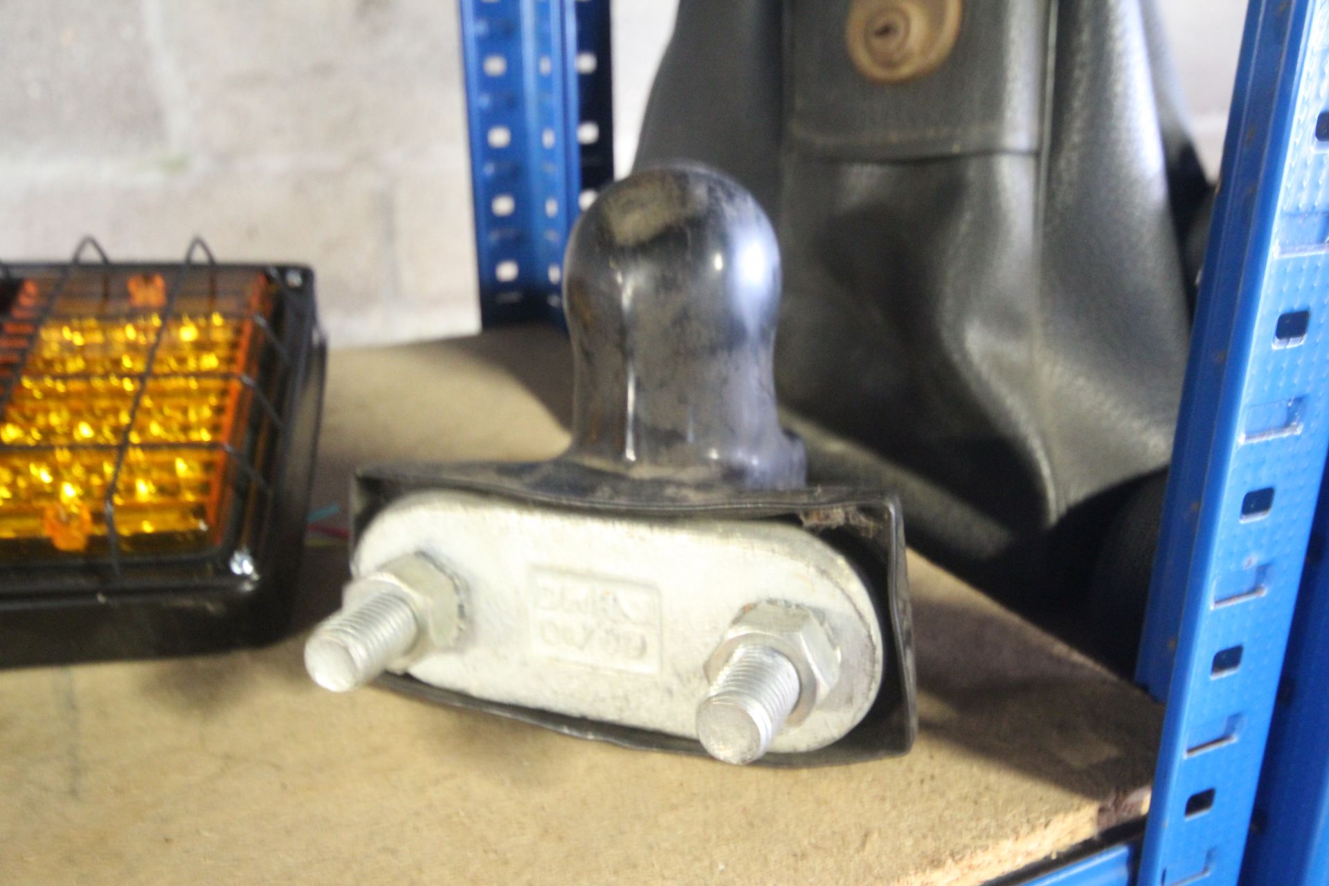 A tow bar ball coupling with rubber cover