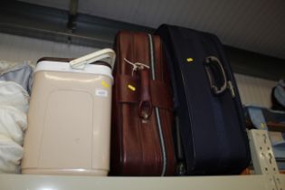 A cool box and two suitcases