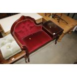 A button back upholstered telephone table