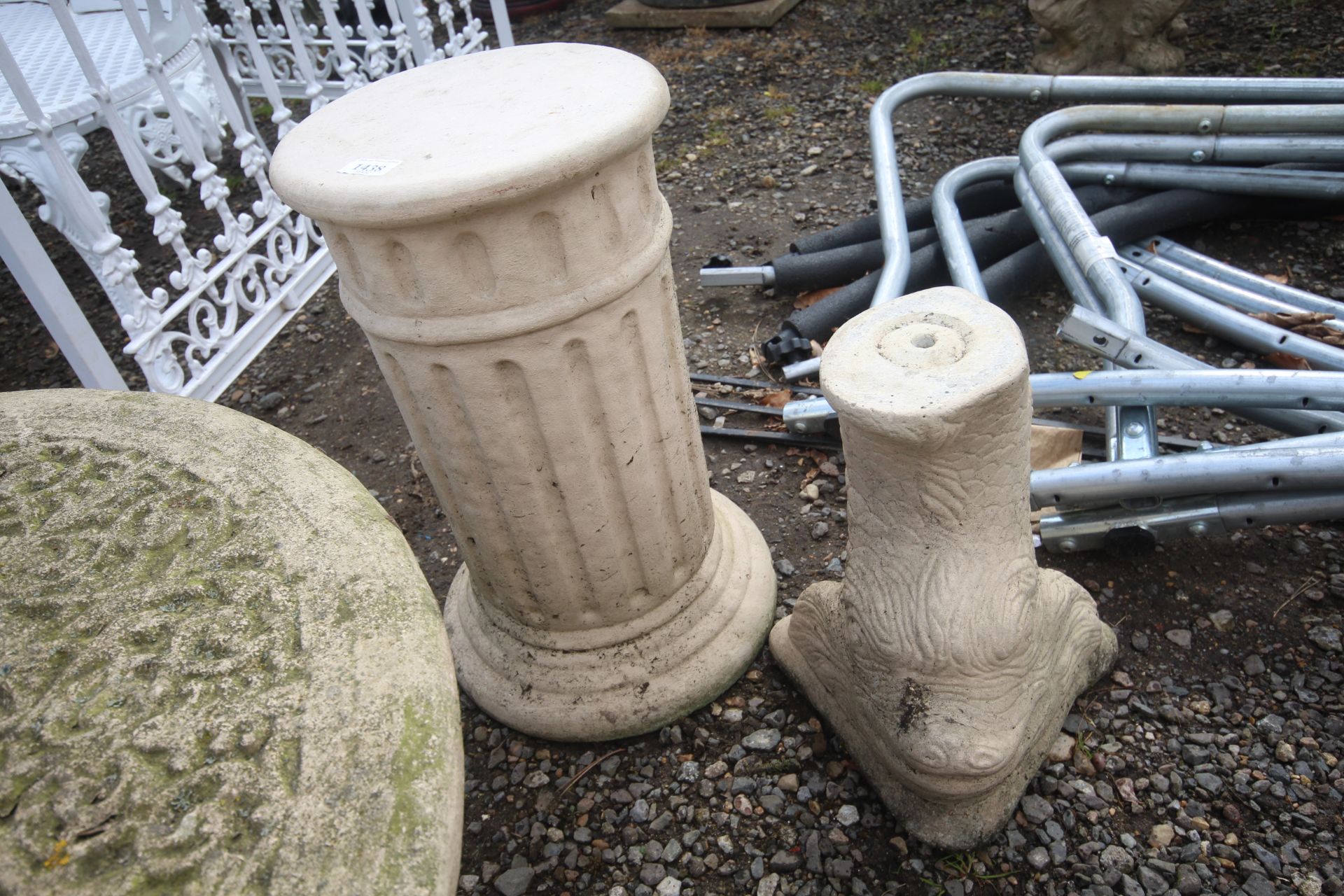 Two painted concrete plinths one in the form of a