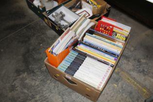 A box of woodworking books and magazines