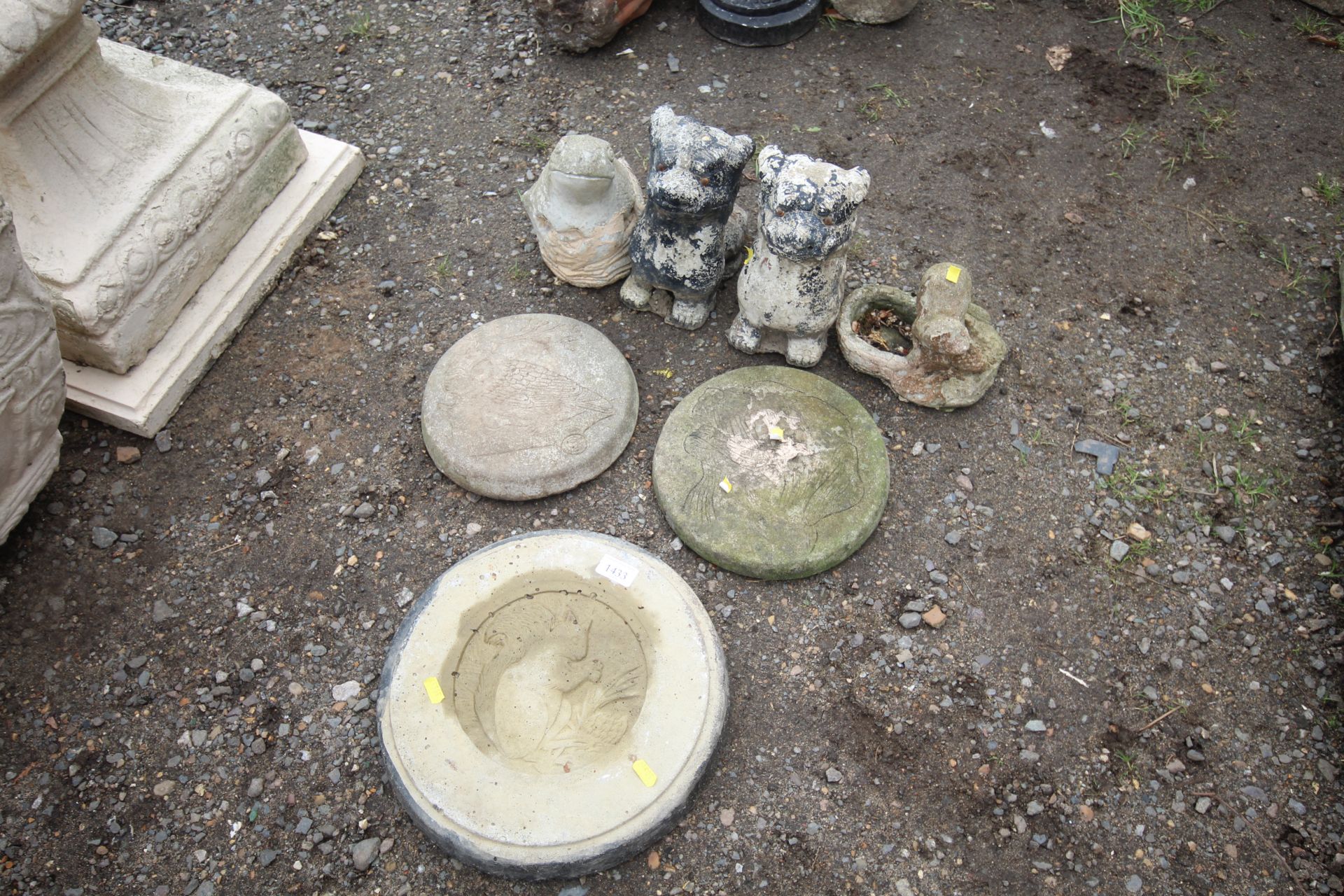 Three concrete plaques decorated in the shape of a