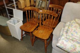 Four pine spindle back chairs