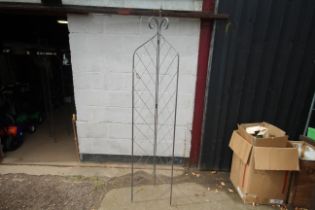 A metal two leaf folding garden trellis (52)