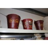 Three reproduction Coca-Cola advertising buckets (