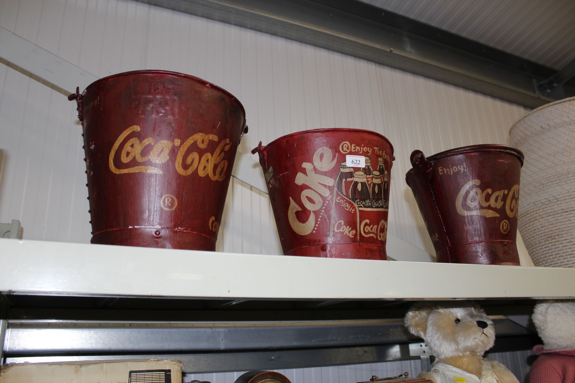 Three reproduction Coca-Cola advertising buckets (