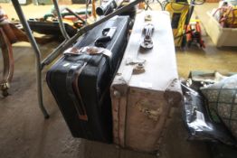 A vintage suitcase and one other