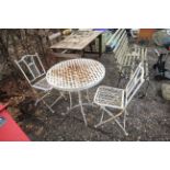 A white painted metal bistro set comprising a circ