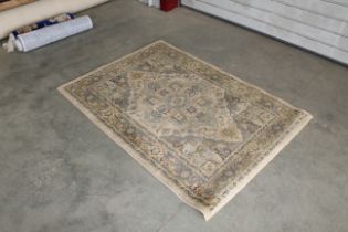 An approx. 5'7" x 4" patterned rug