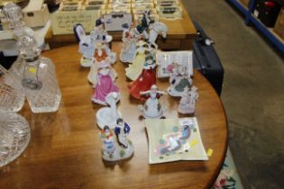 A Staffordshire figural decorated spill holder, four Royal Doulton figures and various other