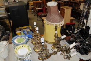 Four figural decorated table lamps and a brass tab