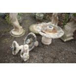 An ornate four part concrete water feature with fi