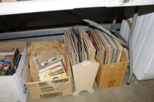 Two boxes and a magazine rack containing records