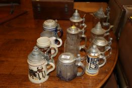 A collection of various glass and pottery beer ste