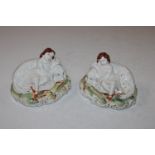 A pair of Staffordshire ornaments in the form of d