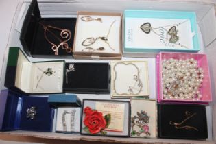 A box containing various boxed costume jewellery