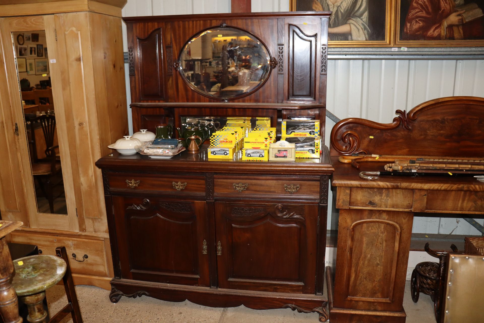 An early 20th Century mahogany and mirror back sid