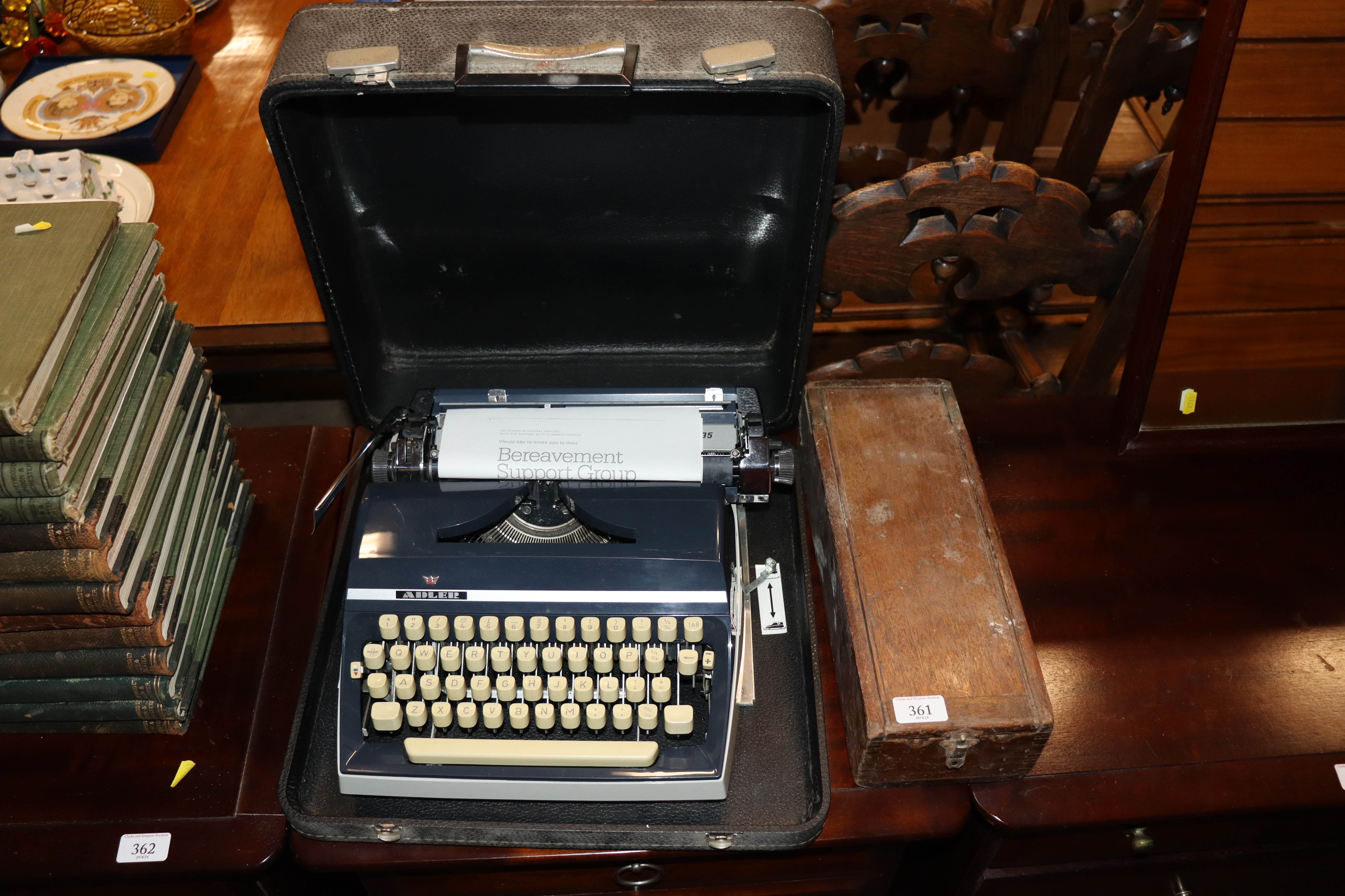 A vintage manual portable typewriter and an old bl