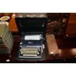 A vintage manual portable typewriter and an old bl