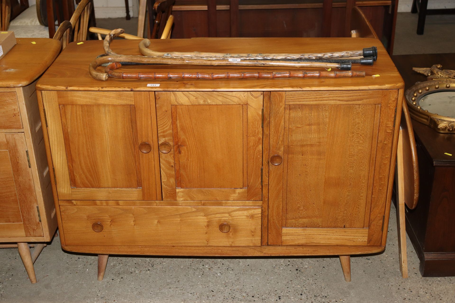 A blonde Ercol sideboard 113cm wide