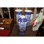 A Chinese blue and white garniture of three vases