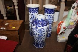 A Chinese blue and white garniture of three vases