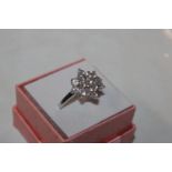 A Sterling silver and cubic zirconia cluster ring,
