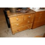 A stripped pine chest of two short and two long dr