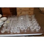 A collection of various cut glass table ware inclu