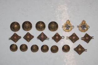 A collection of badges, King Crown buttons, collar