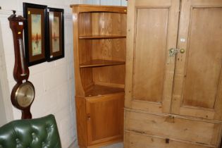 A blonde Ercol corner unit