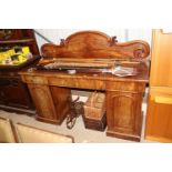 A Victorian mahogany pedestal sideboard